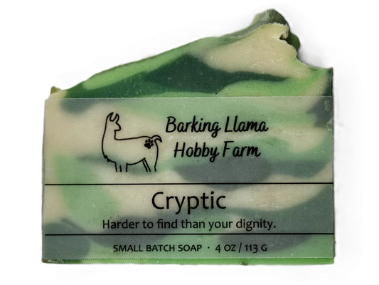 Bar of soap with 'Barking Llama Hobby Farm' branding on a white background. The soap is light green, dark green, and white.