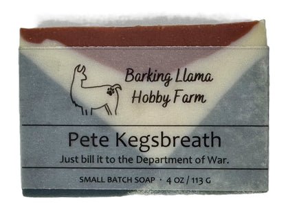 Bar of soap with 'Barking Llama Hobby Farm' branding and text on a white background. The soap is red, white, and blue.