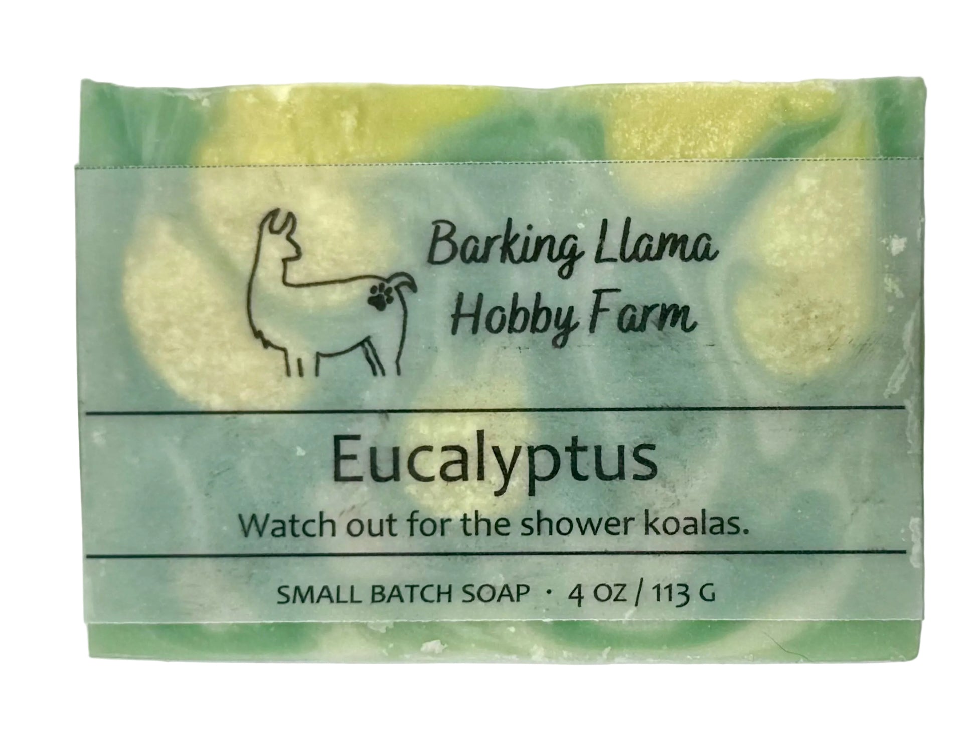 A small rectangular bar of Barking Llama Hobby Farm Eucalyptus soap with a clear paper label, showing a marbled green and pale yellow soap bar behind it.