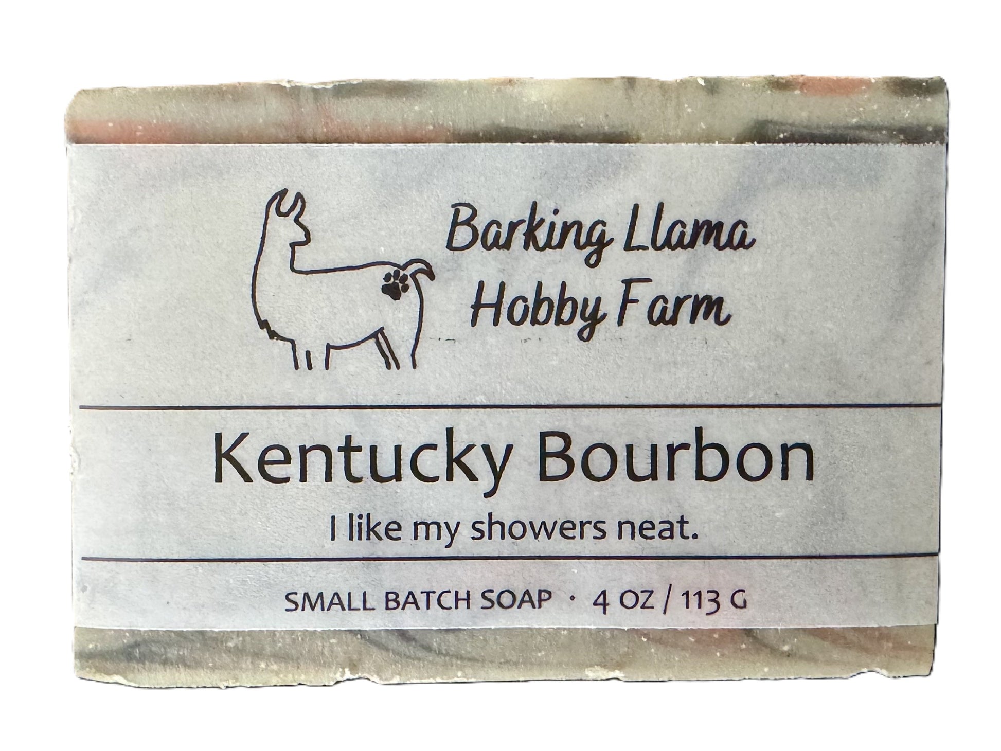 Bar of soap scented in Kentucky Bourbon fragrance. The soap is gray, white, red, and black. It is labeled with the Barking Llama Hobbby Farm logo.